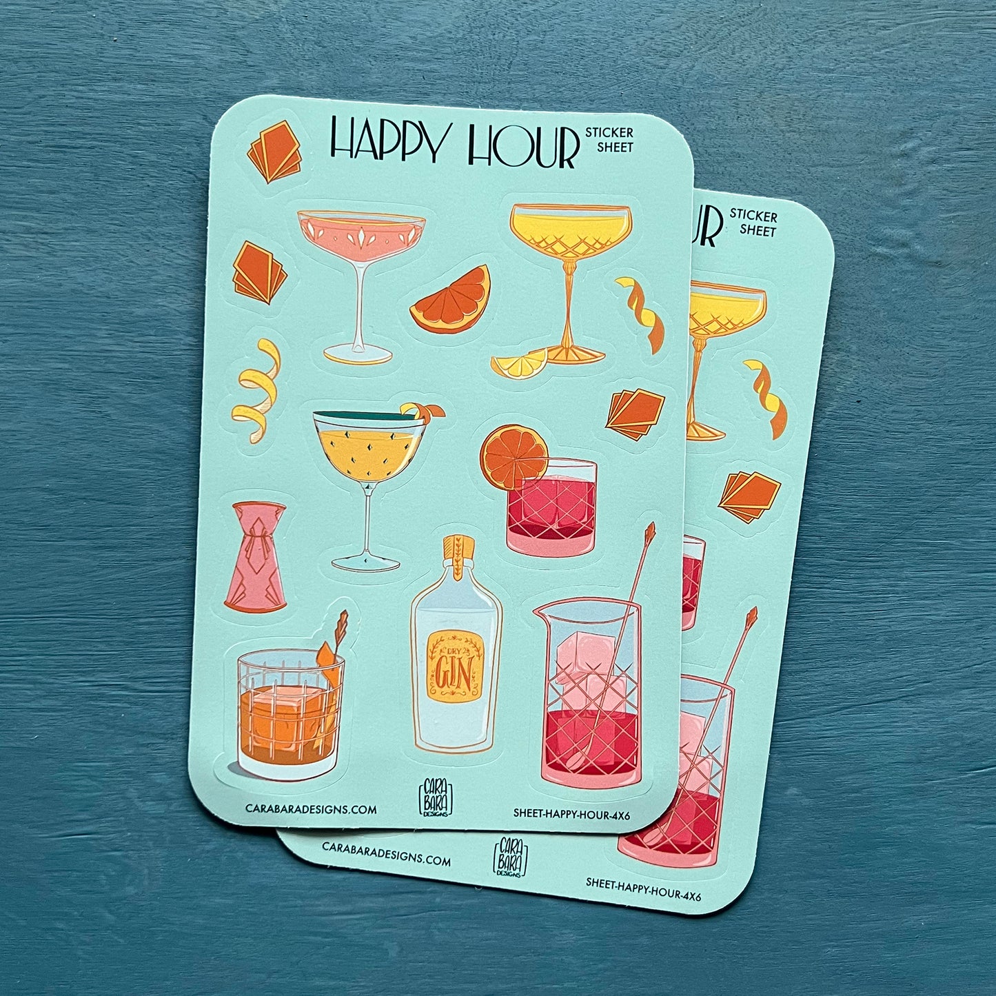 Two art deco cocktail-themed sticker sheets are on a blue background.