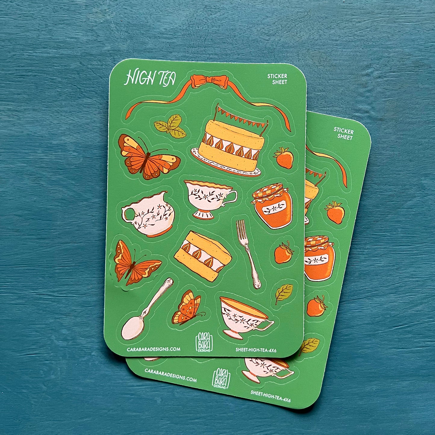 Two cottagecore high tea-themed sticker sheets are on a blue background.