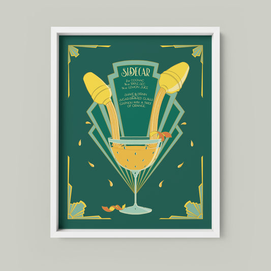 A green and yellow art deco illustration features a hand-lettered recipe for a sidecar as will as images of cocktail shakers and a full glass. The print is shown framed on a light neutral background.