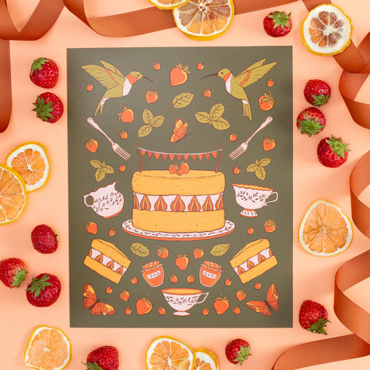 An illustration of a cake with tea, strawberries, and hummingbirds is on orange with lemon slices and strawberries.