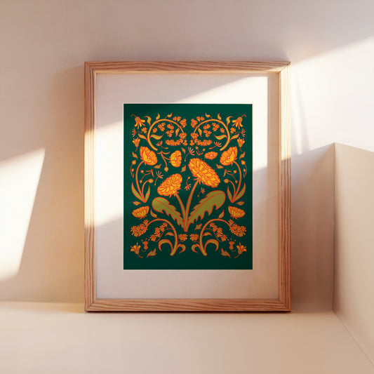 A framed green and yellow dandelion folk floral art print leans against a wall.