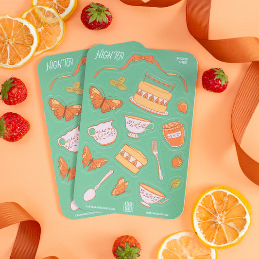 Two cottagecore high tea-themed sticker sheets are on orange with strawberries and ribbon.