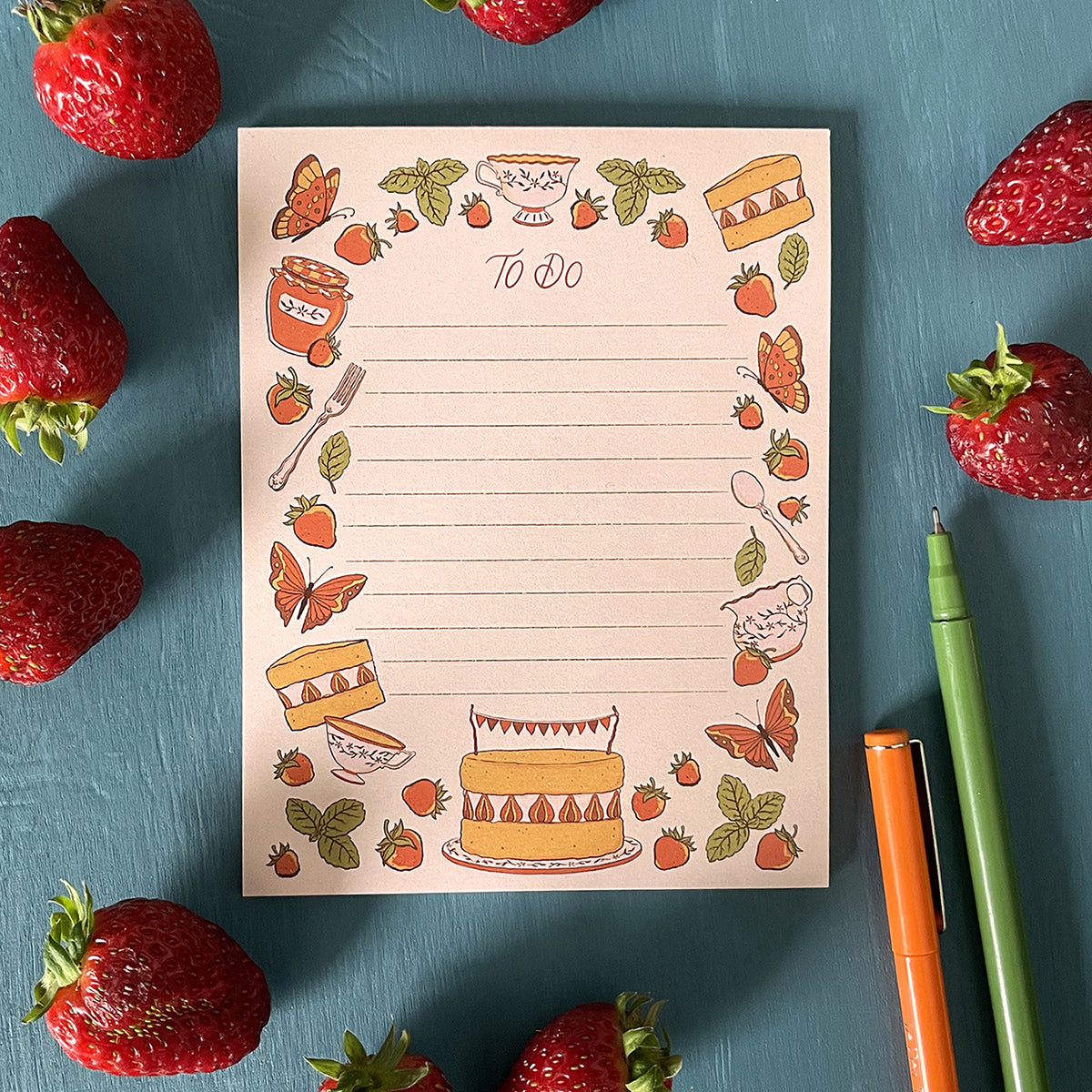 A 25-page lined notepad with hand-lettered To Do and strawberries, mint, cake, teacups, and butterflies.
