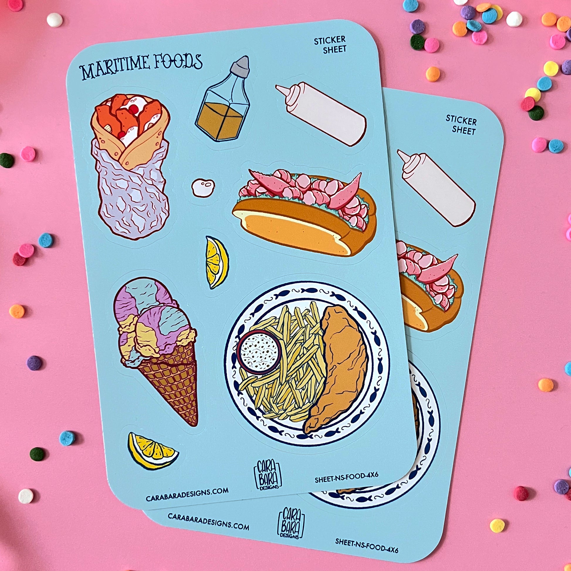 Two colourful sticker sheets full of Nova Scotia foods lie against a pink background.