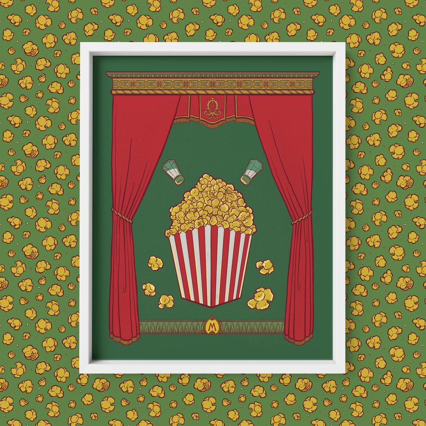 This art print shows a full box of buttery popcorn with salt shakers above it, framed by rich curtains and a detailed capital. An M monogram appears at the bottom. The print is shown framed against a popcorn patterned background.