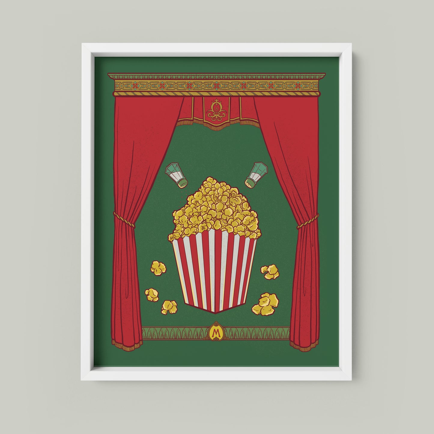 This art print shows a full box of buttery popcorn with salt shakers above it, framed by rich curtains and a detailed capital. An M monogram appears at the bottom. The print is shown framed.