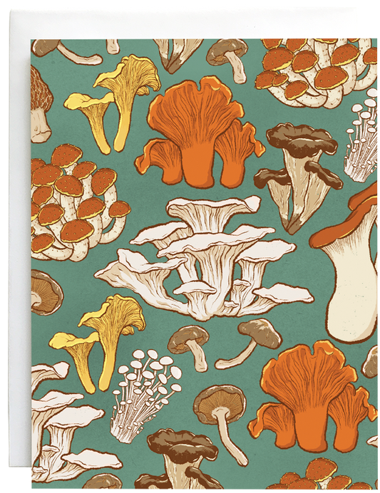 A greeting card patterned with various mushrooms is against a white envelope.