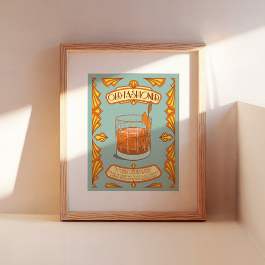 A framed illustrated cocktail recipe for an old-fashioned leans against a wall.