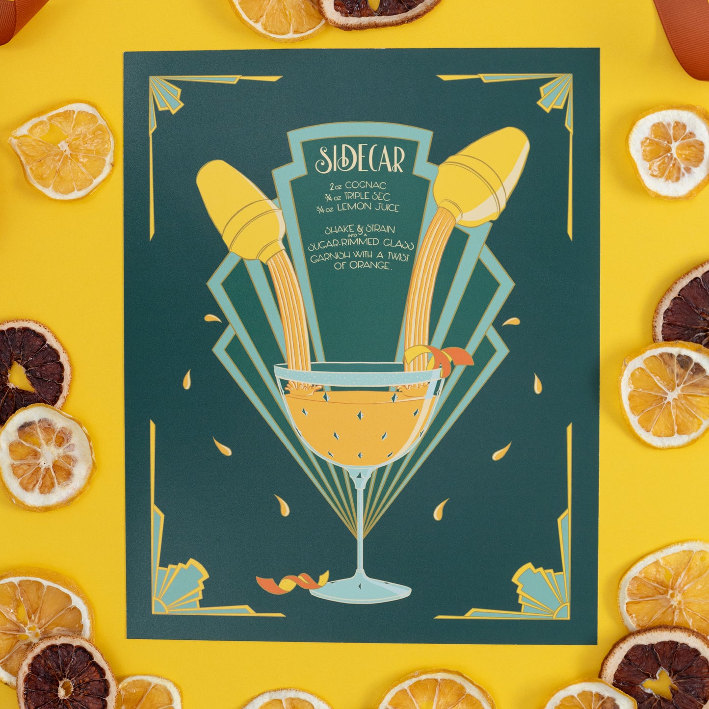 An art deco illustrated recipe for a sidecar is on yellow with citrus slices.