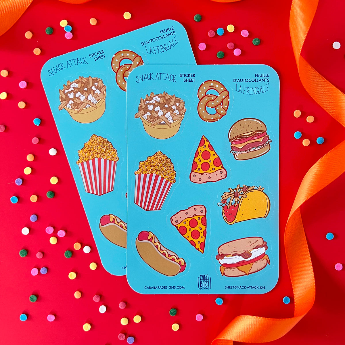 Sticker sheets featuring pizza, poutine, popcorn and more are on red with confetti and orange ribbon.