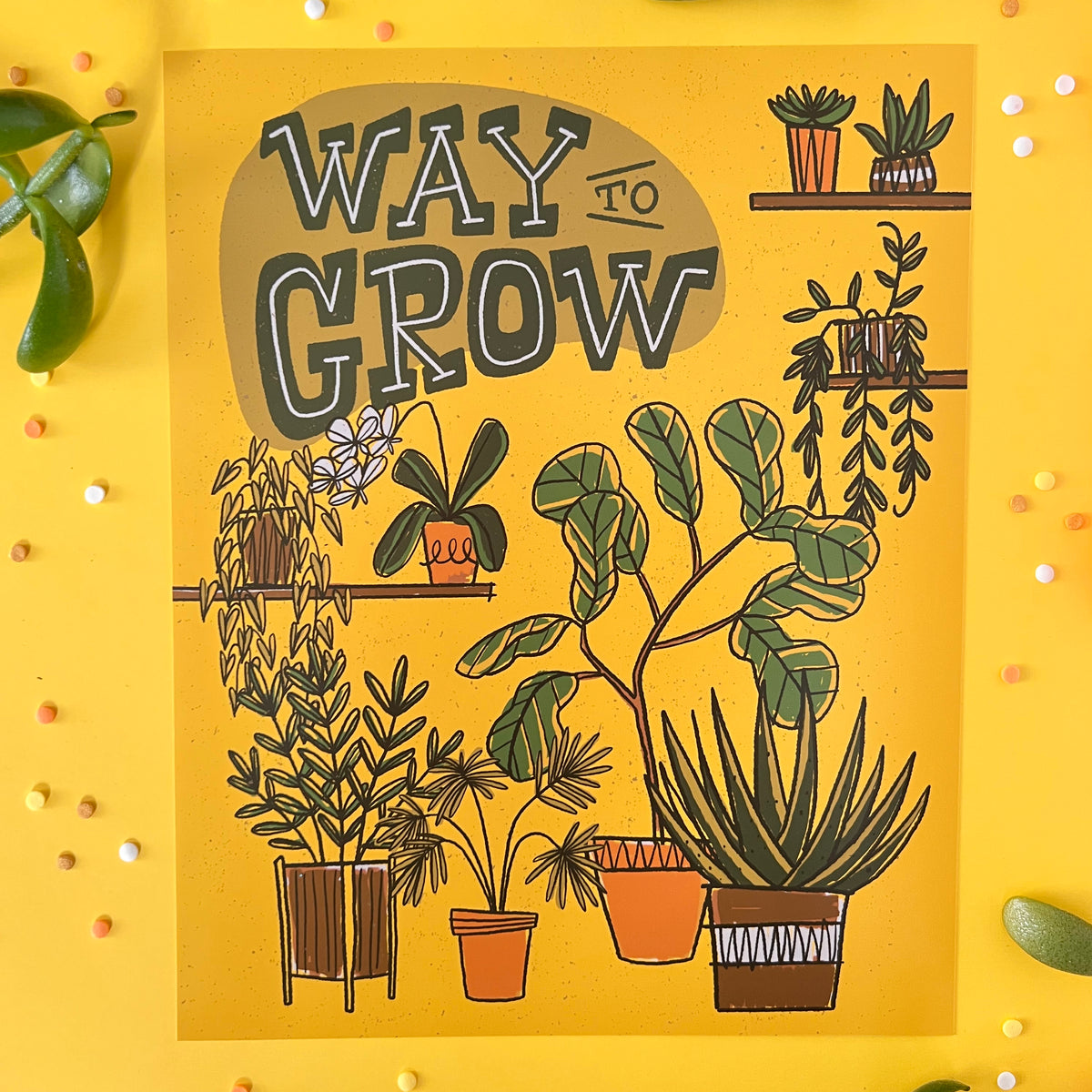 A retro plant illustration with the words way to grow is on yellow with confetti and leaves.