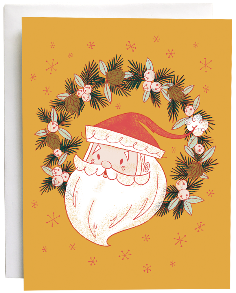 A yellow card shows a midcentury-style illustration of Santa's head in a wreath of jingle bells, pinecones and evergreen branches. The card is against a white envelope on a white background.