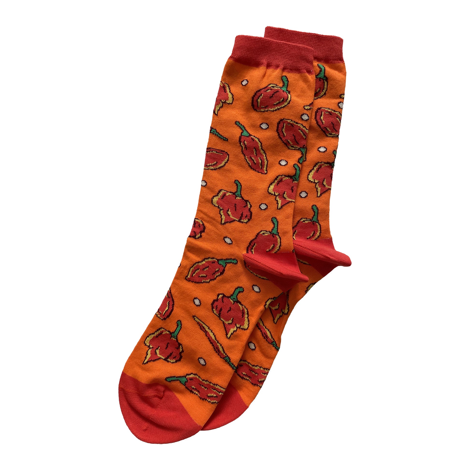 A pair of orange socks is patterned with red hot peppers and has red cuffs, heels and toes.
